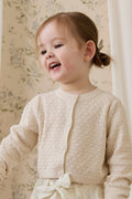 Cardigan en coton tricoté motif losanges classique vanille avec boutonnage avant et poignets côtelés pour enfants de 6 mois à 10 ans