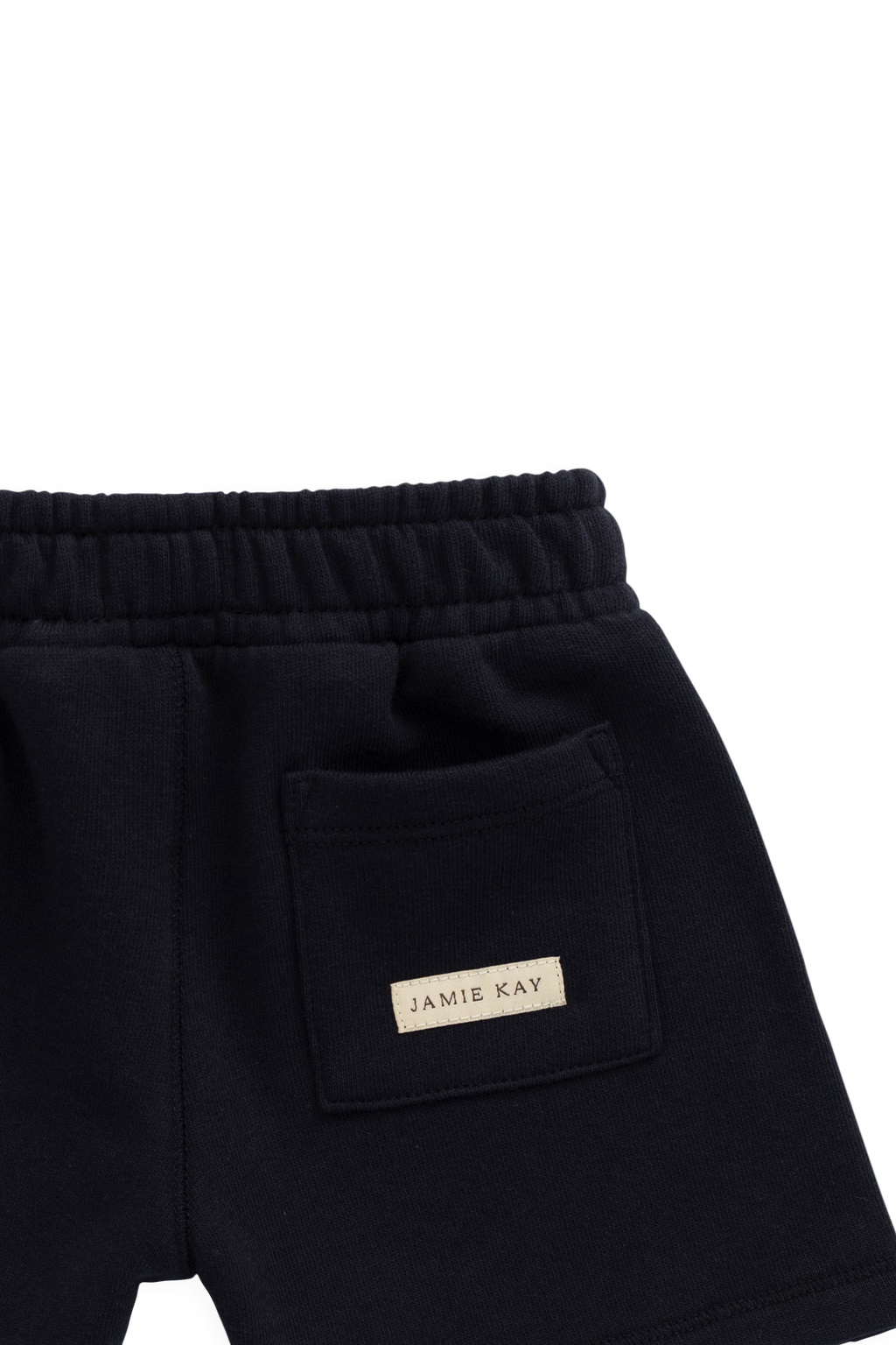 Short ample bleu marine en coton biologique avec taille élastiquée et cordon de serrage avec nœud pour enfants de 6 mois à 8 ans