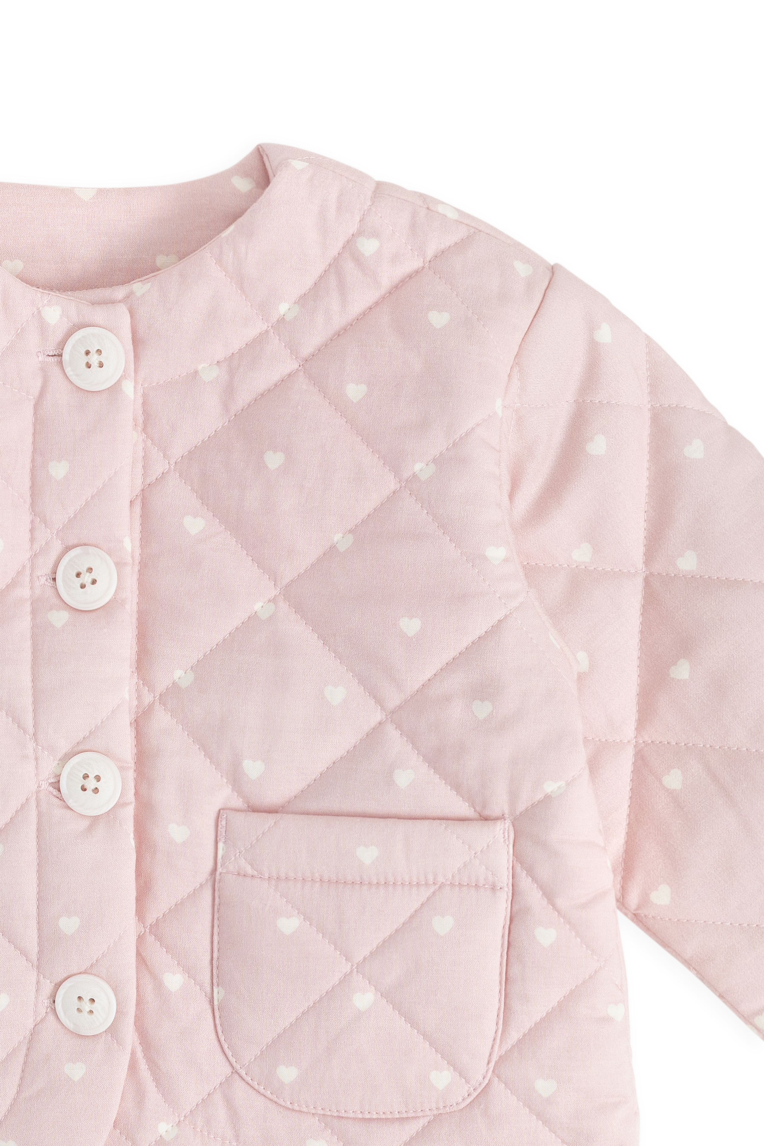 Veste en coton matelassée rose blush romantique à imprimé cœurs avec boutonnage et poches plaquées pour enfants de 6 mois à 10 ans